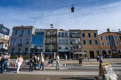 a group of people walking on a city street at Riverside Oasis by LovelyStay in Vila Nova de Gaia