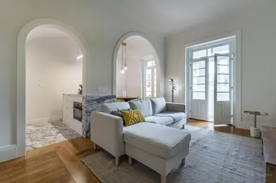 a living room with a couch and a chair at Nomad's Family - 3BDR Charming Hideouts Porto in Porto