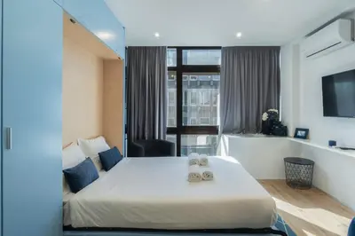 a hotel room with a bed with two towels on it at GuestReady - Oporto Blue Douro Residence in Porto