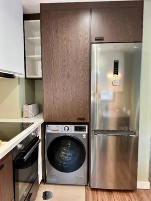 a kitchen with a refrigerator and a washing machine at House Real Companhia 55/53 in Vila Nova de Gaia