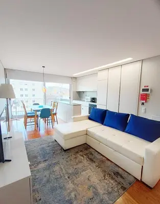 a living room with a white couch and a table at BO - Aníbal Cunha in Porto