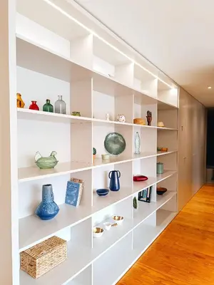 a room with white shelves with vases on them at BO - Aníbal Cunha in Porto