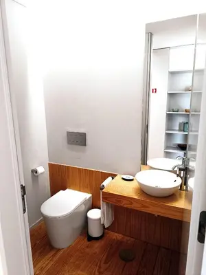 a bathroom with a toilet and a sink at BO - Aníbal Cunha in Porto