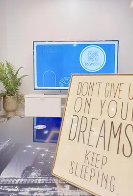 a sign sitting on top of a desk with a computer at Casa del Charm With Terrace in Vila Nova de Gaia
