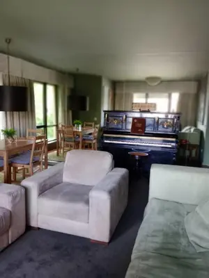 a living room with a couch and a piano at Praceta in Porto