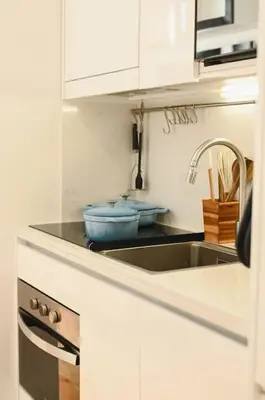 a kitchen with a sink and a counter top at Douro Premium Garden by MP in Vila Nova de Gaia