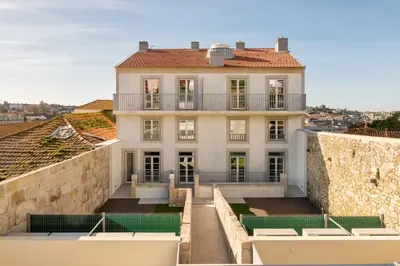 a large white house with a balcony on a wall at Host Wise - Fervença Boutique Palace in Vila Nova de Gaia