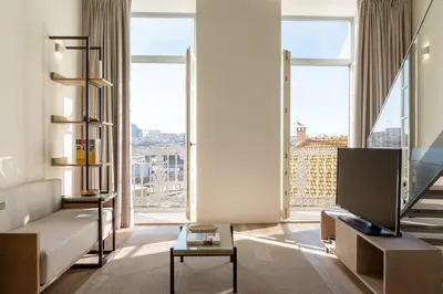 a living room with a couch and a large window at Host Wise - Fervença Boutique Palace in Vila Nova de Gaia