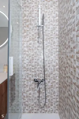 a shower with a glass door in a bathroom at Cedofeita Sunny Apartment - Balcony & Parking in Porto