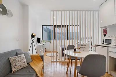a living room with a couch and a table at Seni's House in Porto