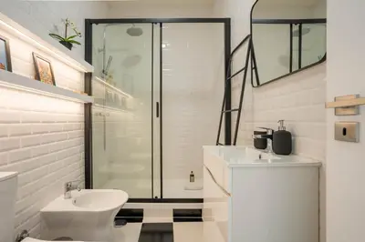 a bathroom with a shower and a toilet and a sink at Porto Heights by LovelyStay in Porto