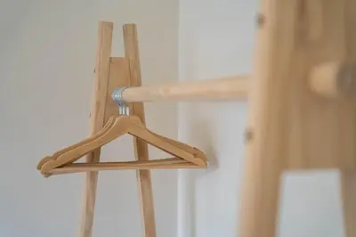 a wooden ladder with a hanger on it at Porto Heights by LovelyStay in Porto