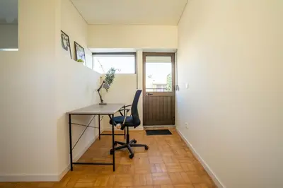 an office with a desk and a chair in a hallway at Porto Heights by LovelyStay in Porto