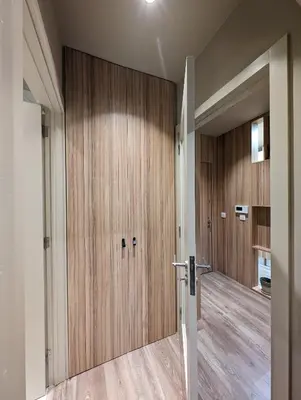 a hallway with wooden doors in a house at BonJardim Apartment by Nove in Porto