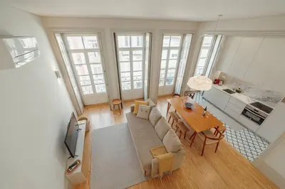 a living room with a couch and a table at Deluxe Duplex by Hosty in Porto