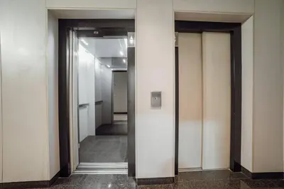 a hallway with two elevators in a building at Trindade Deluxe by Hosty in Porto