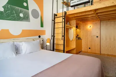 a bedroom with a bed and a bunk bed at Limehome Porto Rua da Conceicao in Porto