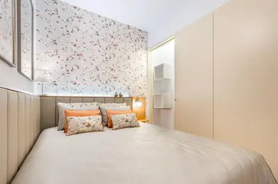 a bedroom with a large bed with orange pillows at Stylish Poveiros Flat w Balcony by LovelyStay in Porto