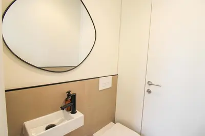a bathroom with a sink and a mirror at Saudade do Porto in Porto