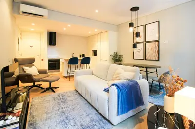 a living room with a couch and a table at Dream Design Flat in Porto