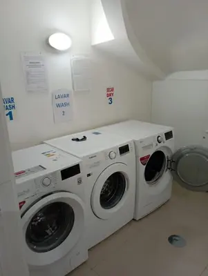 a laundry room with two washing machines in it at Rooftop Panoramic Batalha- PORTO in Porto