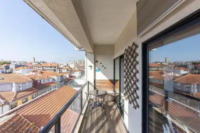 a balcony with a view of the city at Top floor apartment with Sunny Balconies in Porto