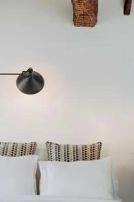 a bedroom with a large bed with a wooden headboard at Rosário Suites Townhouse in Porto
