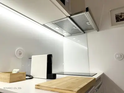 a kitchen with white walls and a ceiling at ROSARIO 1Ds by rosario inn porto in Porto