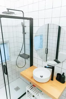 a bathroom with a sink and a mirror at Cedofeita studio 41 in Porto