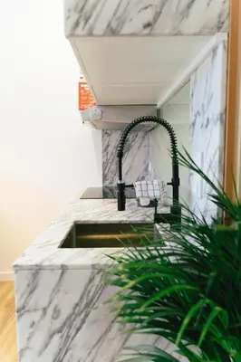 a bathroom with a sink with a faucet at Cedofeita studio 41 in Porto