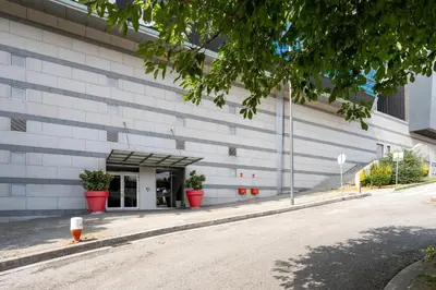 a building with potted plants in front of it at VIVA Stadium Residence Studios in Porto