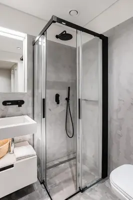 a shower with a glass door in a bathroom at Elegant Duplex Apt in Downtown by Lisbeyond in Porto