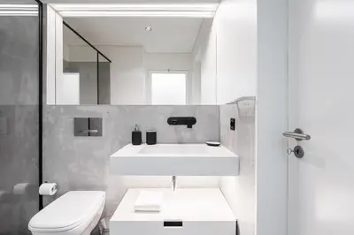 a bathroom with a white sink and a toilet at Elegant Duplex Apt in Downtown by Lisbeyond in Porto