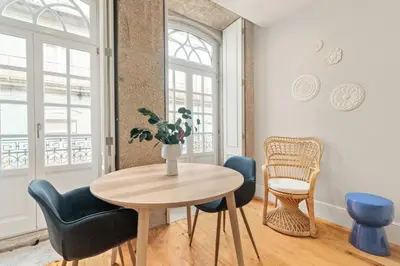 a dining room with a table and chairs at Almada Prime - Live in Porto in Porto