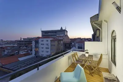 a balcony with a view of a city at Fernandes Tomas Rooftop in Porto