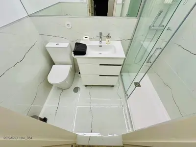 a bathroom with a toilet and a sink and a shower at ROSARIO 1Dn by rosario inn porto in Porto