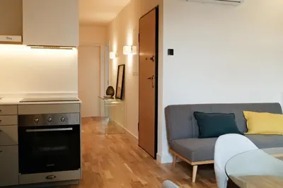 a living room with a couch and a table at Corujeira Apartments by MyALPlace in Porto