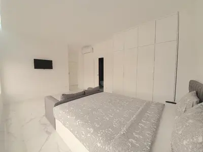 a white bedroom with a large bed in it at VB Porto Studio II in Porto