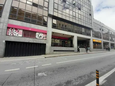 an empty street in front of a tall building at VB Porto Studio II in Porto