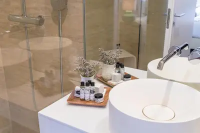 a bathroom with a white sink and a shower at Bandeiras in Porto