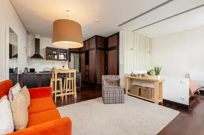 a living room with a couch and a kitchen at YOUROPO - Torre in Porto