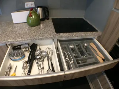 a kitchen drawer filled with utensils on a counter at Miradouro 25 - Porto centre - luxury epic views in Porto