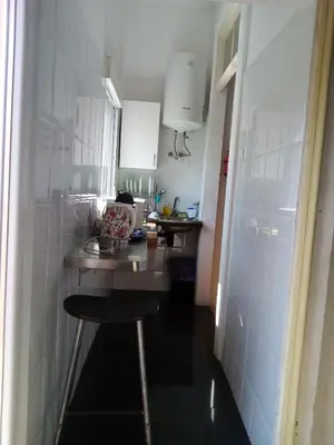 a kitchen sink with utensils on a counter at Metro Casa Música Apartments and Rooms in Porto