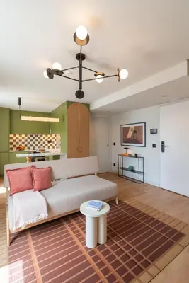 a bedroom with a white bed and a green wall at Hotels 705 Porto Prime Apartments in Porto