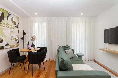 a living room with a couch and a table at GuestReady - Dream Vitoria Apartment in Porto