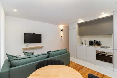 a living room with a couch and a table at GuestReady - Dream Vitoria Apartment in Porto