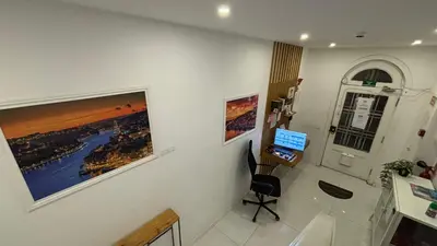 a room with a desk and a computer on a wall at Owls Hostel Ribeiro in Porto