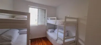 a room with three bunk beds and a window at Owls Hostel Ribeiro in Porto