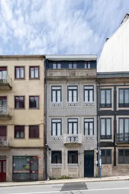 an apartment building on the corner of a street at Host Wise - Santa Catarina Cosy Downtown in Porto