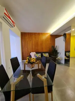 a living room with a glass table and chairs at INSOLI I Porto by Apartments2Stay in Porto